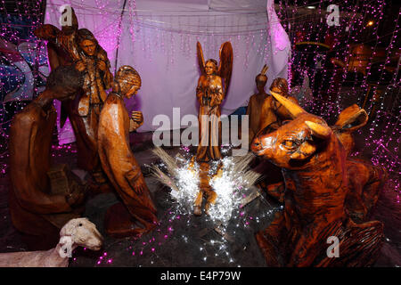 Large Andean style outdoor Christmas nativity scene with wooden statues, La Paz , Bolivia Stock Photo