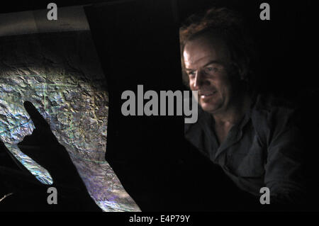 Man checking topographic map at night. No MR Stock Photo