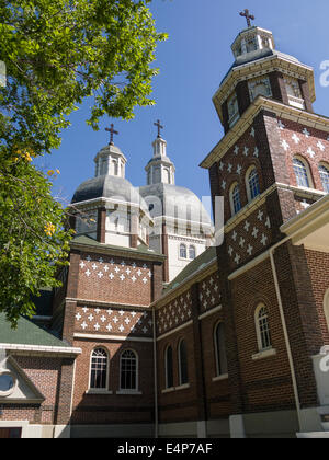 Ukrainian Catholic Cathedral in Edmonton. The solid brick cathedral is topped by two domes and a tower each with an ornate iron Stock Photo