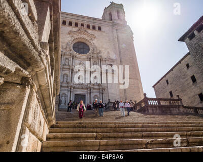 Leaving Girona's Cathedral. Tourists descend the wide steps from Girona's massive cathedral. Stock Photo