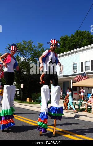 Performers on stilts taking part in 4th of July Independence Day parades, Catonsville, Maryland, USA Stock Photo