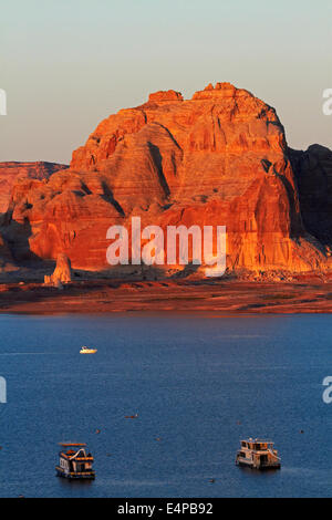 Houseboats on Lake Powell at Wahweap, near Page, Arizona, and late light on far shoreline in Utah, USA Stock Photo