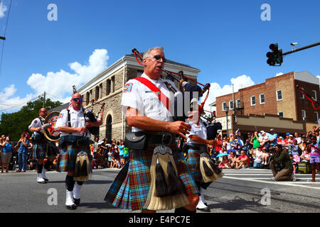 Bagpiper of Greater Baltimore Fire Brigade Pipes and Drums Highland Band parading during July 4th Independence Day parades, Catonsville, Maryland, USA Stock Photo