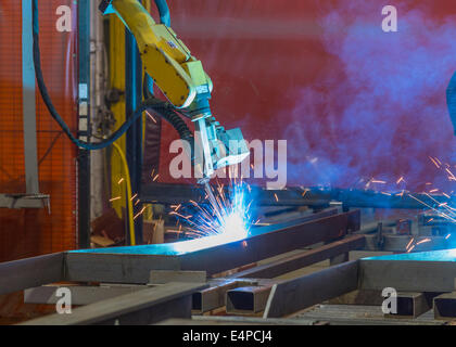 Robotic Welder In Factory Stock Photo