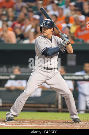 New York Yankees left fielder Kelly Johnson (33) bats in the second inning against the Baltimore Orioles at Oriole Park at Camden Yards in Baltimore, MD on Sunday, July 13, 2014. He grounded out to the pitcher to end the inning. Credit: Ron Sachs / CNP Stock Photo