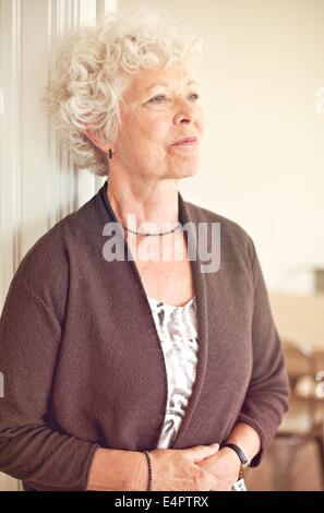Senior woman looking away and thinking about something Stock Photo