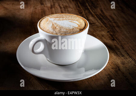 Image of a cup cappuccino on a wooden table Stock Photo