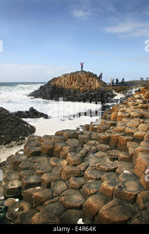 Person standing on top of Giant's Causeway, Northern Ireland Stock Photo