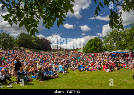 5th July 2014 - Crowds in Ilkley enjoy blue skies in summery weather outside watching the Tour de France Grand depart in Yorkshire on the big screen Stock Photo