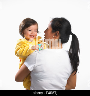 Woman holding young boy in arms