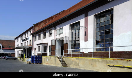 Zatec brewery, which recently sold its majority share to the multinational corporation Carlsberg, heads to the Russian and Canadian market. Currently, the Zatec beer is exported to 17 countries on four continents, brewery brews 11 kinds and brands of beers. Building of the Zatec brewery is seen in Zatec, Czech Republic, July 16, 2014. (CTK Photo/Libor Zavoral) Stock Photo