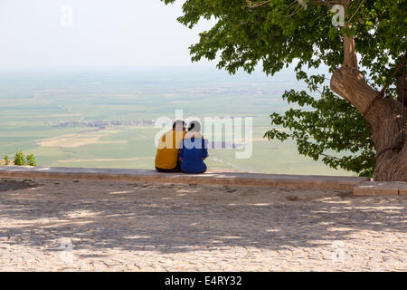 amorous couple beside tree, Mardin, Turkey Stock Photo