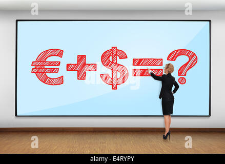 businesswoman in office pointing to big plasma with business formula Stock Photo