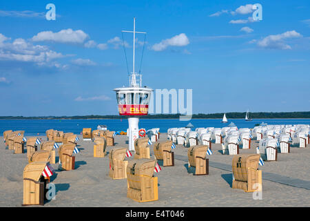 Roofed wicker beach chairs on the beach at Travemuende, Luebeck, Schleswig-Holstein, Germany Stock Photo