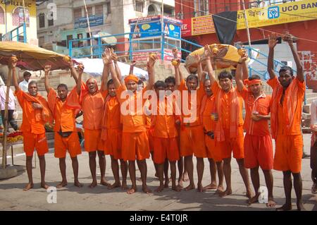 River Ganga, India. 16th July, 2014. The devotees or 'Kawariyas' perform rituals after their holy bath in River Ganga during the Hindus holiest month Sawan in Varanasi. © Somit Bardhan/Pacific Press/Alamy Live News Stock Photo