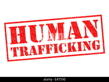 HUMAN TRAFFICKING red Rubber Stamp over a white background. Stock Photo