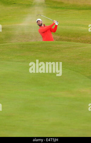 Hoylake, UK. 16th July, 2014. The Open Golf Championship. Paul Casey taking bunker shot on 16th hole during a practice round at the Royal Liverpool Golf Club in Hoylake, Merseyside Stock Photo