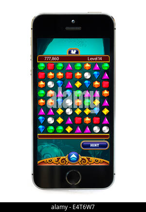 Playing the popular free game Bejeweled on an Apple iPhone 5S Stock Photo