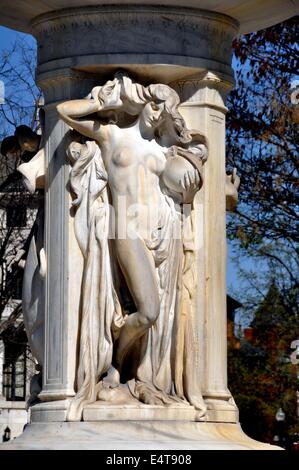 Washington, DC:  Allegorical figures decorating Daniel Chester French's white marble fountain at the center of Dupont Circle Stock Photo