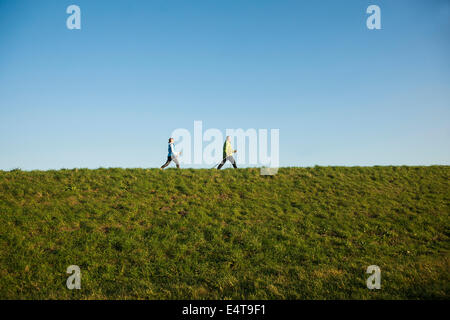 Man and Woman Nordic Walking Outdoors, Baden-Wurttemberg, Germany Stock Photo