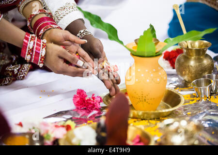 Close-up of Bride and Groom's Hands at Hindu Wedding Ceremony, Toronto, Ontario, Canada Stock Photo