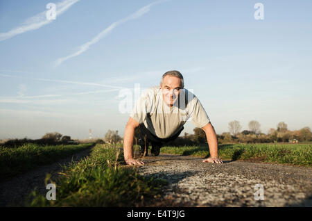 Senior Man doing Pushups Outdoors, Baden-Wurttemberg, Germany Stock Photo