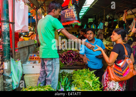 Sri Lankan couple shopping at food market Kandy Sri Lanka Stock Photo