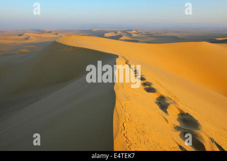 Scenic view and Footprints on top of Sand Dune, Matruh, Great Sand Sea, Libyan Desert, Sahara Desert, Egypt, North Africa Stock Photo