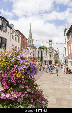 Chichester city centre and Chichester Cross on a busy sunny summer day with colourful display of flowers, West Sussex, UK Stock Photo