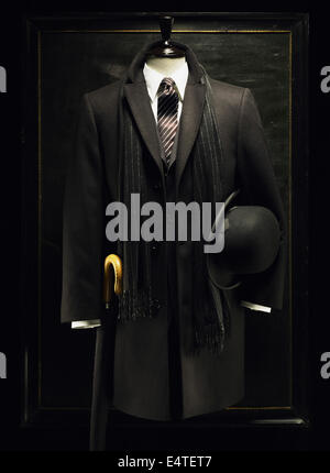 Mannequin with Men's Jacket, Bowler Hat, Scarf and Umbrella Stock Photo