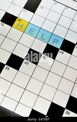 Close-up of crossword puzzle on LCD tablet screen, showing the word help, studio shot Stock Photo