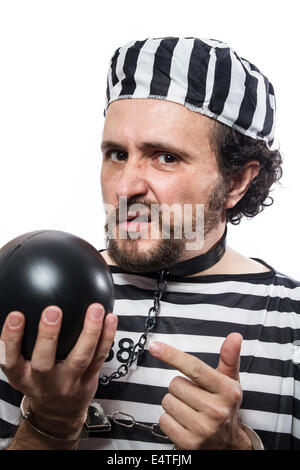 Solution, one caucasian man prisoner criminal with chain ball and handcuffs in studio isolated on white background Stock Photo