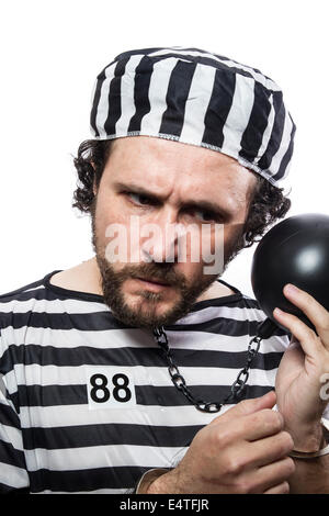 Fun, one caucasian man prisoner criminal with chain ball and handcuffs in studio isolated on white background Stock Photo