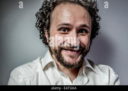 derision, man with intense expression, white shirt Stock Photo