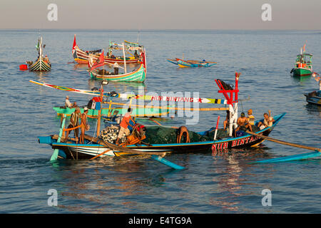 Jimbaran, Bali, Indonesia.  Fishing Boat Heading out to Sea in the Early Morning. Stock Photo