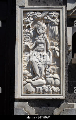 Jimbaran, Bali, Indonesia.  Traditional Hindu Figures in Stone, Flanking Entrance to a Private Home. Stock Photo