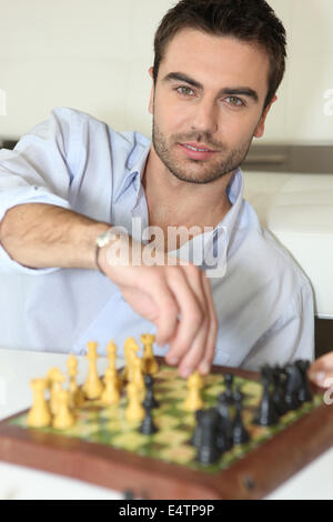 Man playing chess Stock Photo