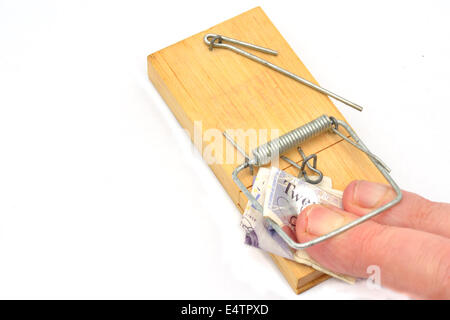 fingers trapped in mosetrap money grabbing Stock Photo