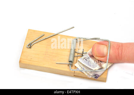 thumb in mousetrap Stock Photo