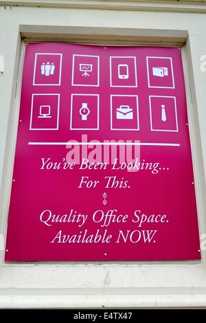 Quality office space available now sign covering a window frame England uk Stock Photo