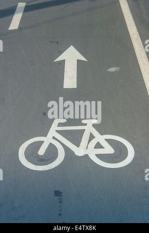 Bike lane sign on asphalt Stock Photo