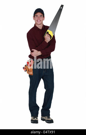 Handyman with a handsaw Stock Photo