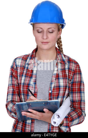 craftswoman taking notes Stock Photo