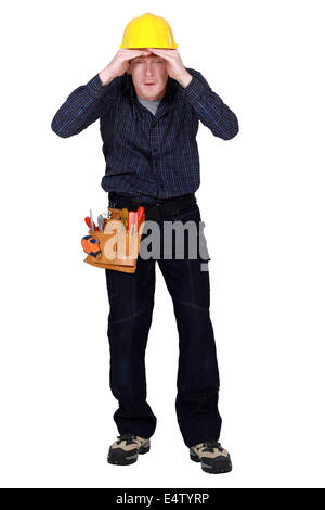 Construction worker peering into the distance Stock Photo