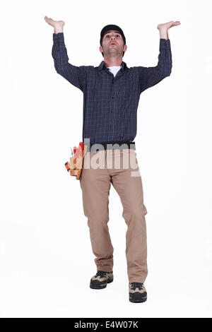 Laborer gesturing on white background Stock Photo