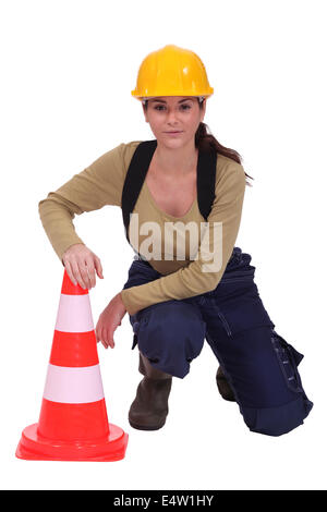 Woman with a traffic cone Stock Photo