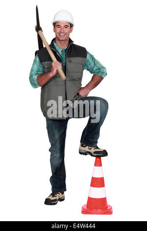 Man holding a pickaxe Stock Photo