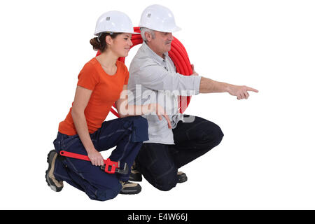Plumber and female apprentice Stock Photo