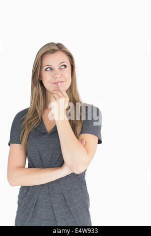 Blonde woman thinking Stock Photo