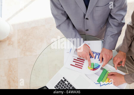 Analysts looking at research data Stock Photo